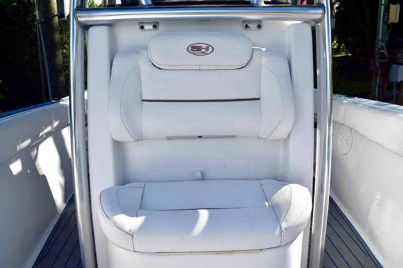 Slide: The Image of White seating on 2018 Sea Hunt Ultra 211 boat, featuring sleek design and comfortable upholstery. - 25