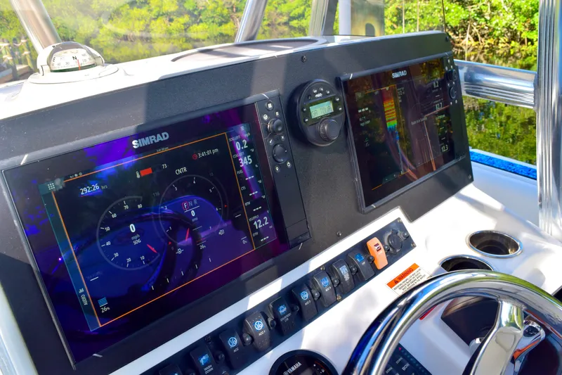 Slide: The Image of Simrad marine electronics display on 2018 Sea Hunt Ultra 211 boat dashboard. - 40