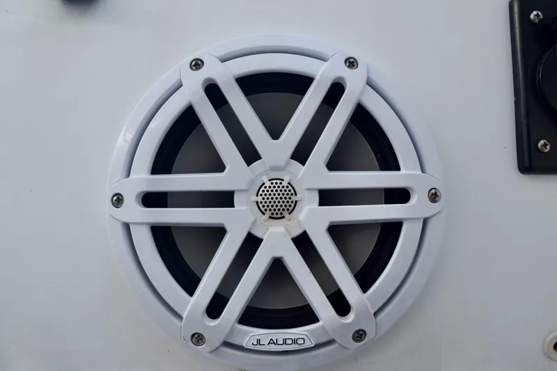 Slide: The Image of White JL Audio speaker on 2018 Sea Hunt Ultra 211 boat. - 43