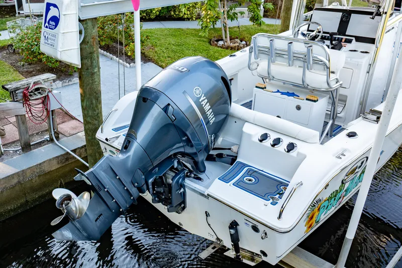 Slide: The Image of 2018 Sea Hunt Ultra 211 boat motor and propeller in water. - 46