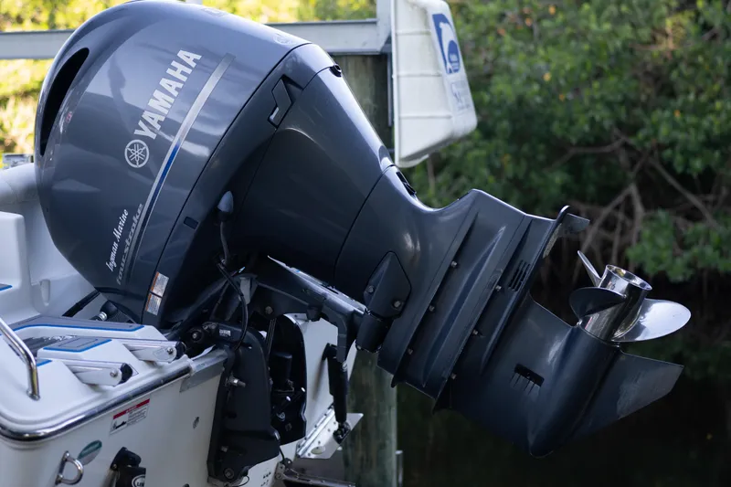 Slide: The Image of 2018 Sea Hunt Ultra 211 boat interior with seating and tropical background. - 49