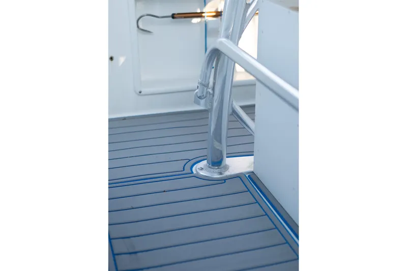 Slide: The Image of 2018 Sea Hunt Ultra 211 boat interior with white seating and cup holders. - 50