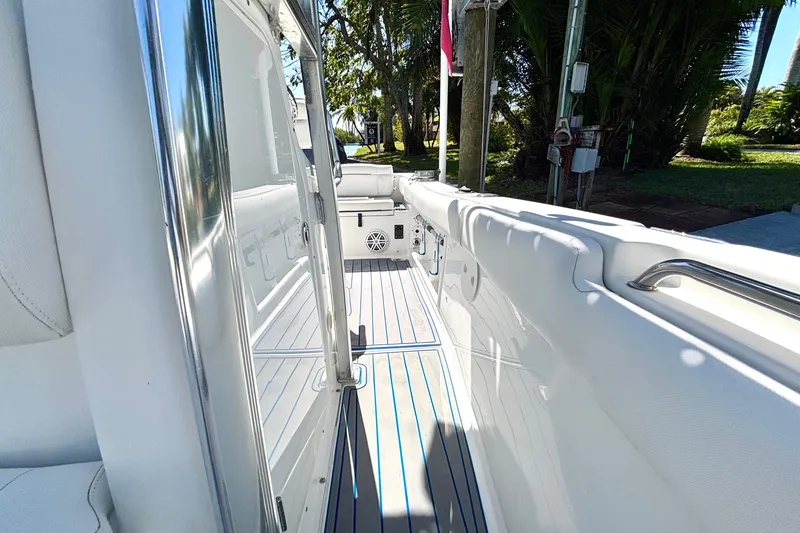 Slide: The Image of 2018 Sea Hunt Ultra 211 boat interior with sleek white design and modern features. - 81