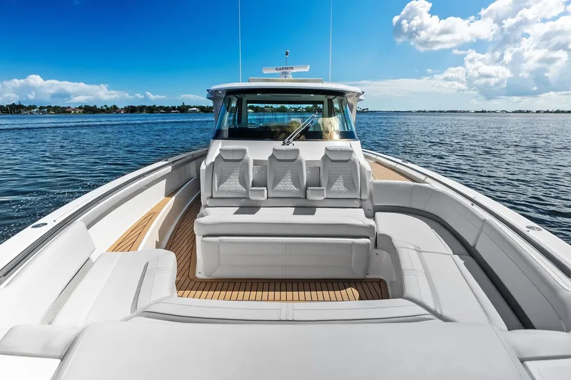Slide: The Image of 2024 Tiara Yachts 48 LS luxury boat with spacious seating on open water. - 38