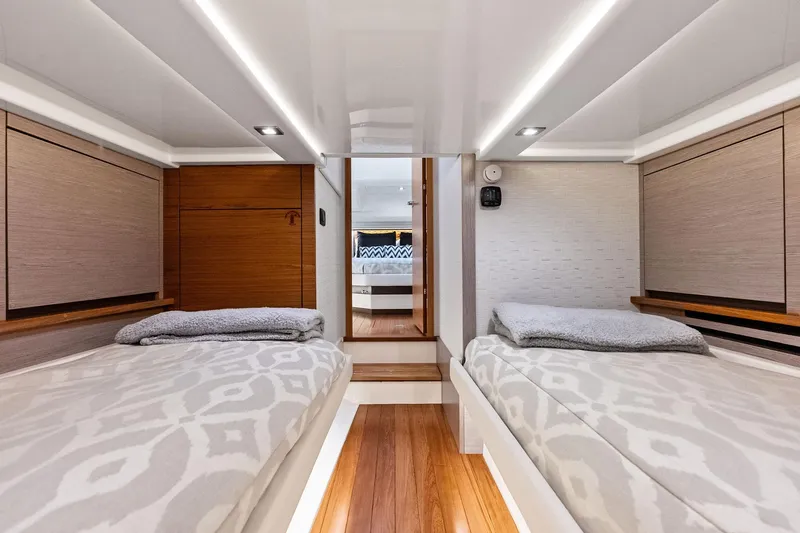 Slide: The Image of Luxurious 2024 Tiara Yachts 48 LS interior cabin with twin beds and modern design. - 51
