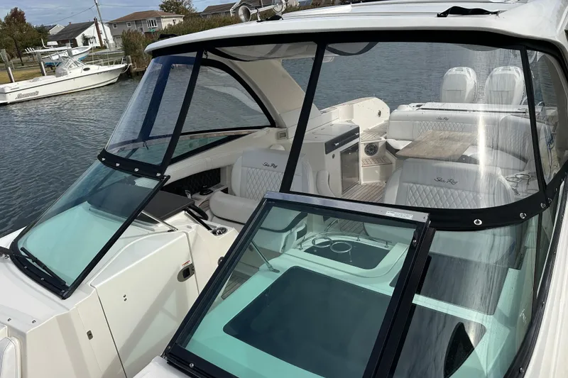 Slide: The Image of 2019 Sea Ray SLX 350 Outboard boat with sleek design and luxurious interior. - 13
