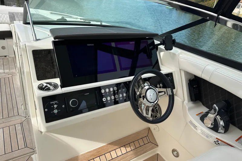 Slide: The Image of 2019 Sea Ray SLX 350 Outboard helm with modern controls and navigation system. - 14