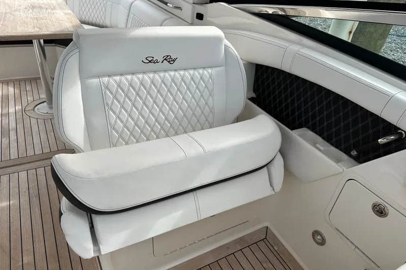 Slide: The Image of Luxurious white seating on 2019 Sea Ray SLX 350 Outboard boat interior. - 18