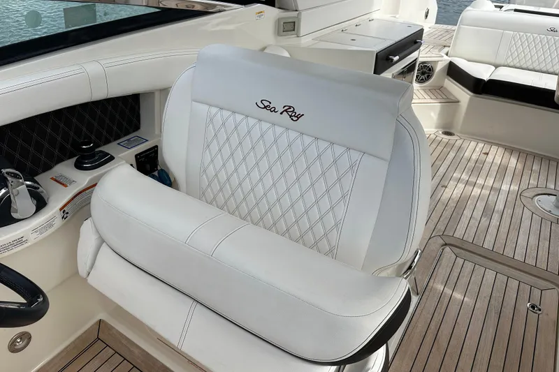 Slide: The Image of Luxurious interior of 2019 Sea Ray SLX 350 Outboard with elegant seating and wood flooring. - 22