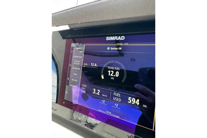 Slide: The Image of Simrad display on 2019 Sea Ray SLX 350 Outboard showing fuel data and system status. - 26