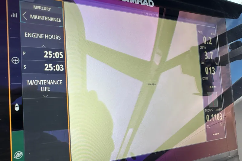 Slide: The Image of Display screen of 2019 Sea Ray SLX 350 Outboard showing engine hours and navigation data. - 28