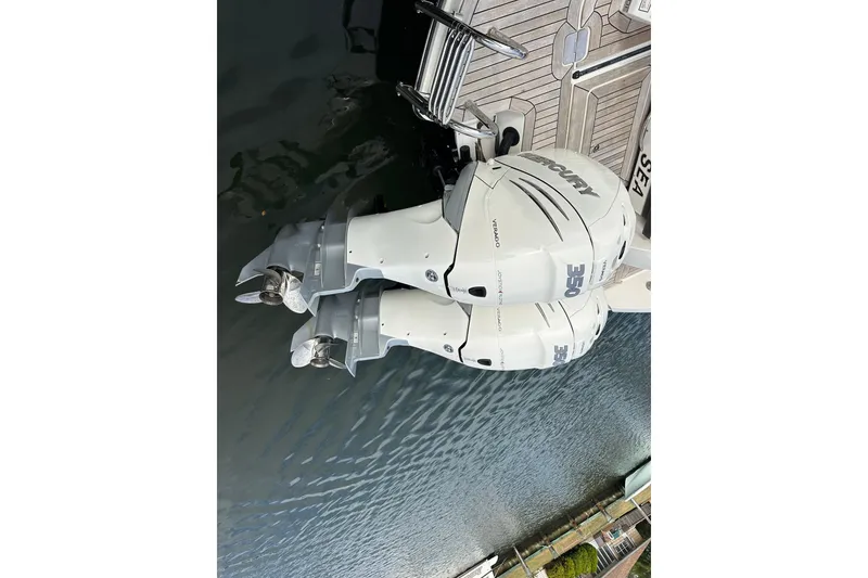 Slide: The Image of 2019 Sea Ray SLX 350 Outboard with twin Mercury engines on water. - 7