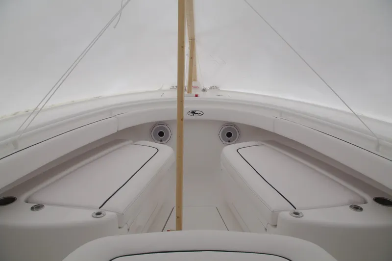Slide: The Image of 2025 Valhalla Boatworks V-33 interior, white seating and storage compartments. - 32
