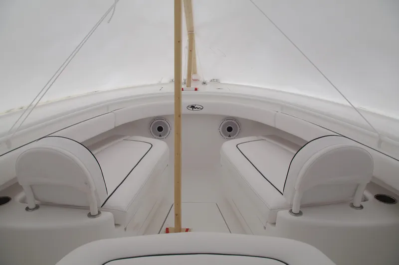 Slide: The Image of 2025 Valhalla Boatworks V-33 interior with white seating and sleek design. - 33