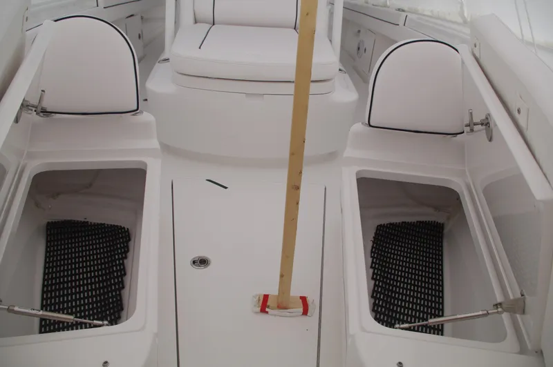Slide: The Image of 2025 Valhalla Boatworks V-33 interior with storage compartments and seating. - 35