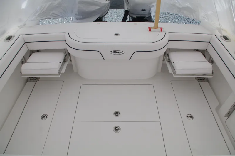 Slide: The Image of 2025 Valhalla Boatworks V-33 deck with seating and storage compartments. - 40