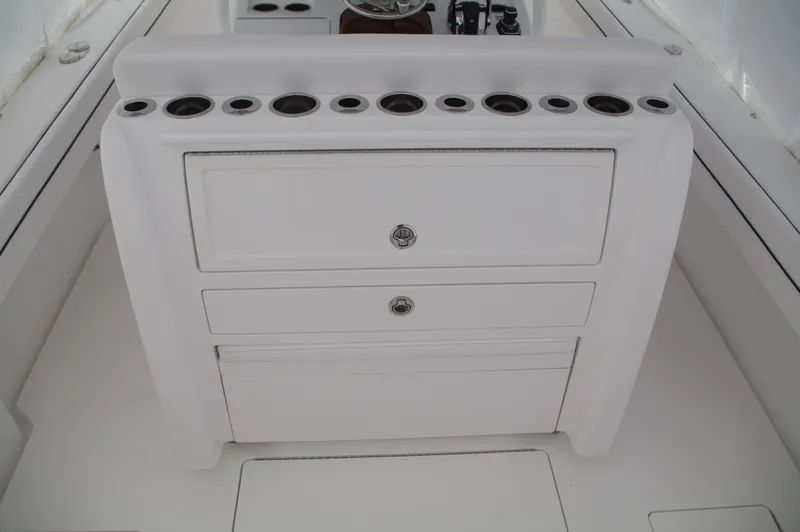 Slide: The Image of 2025 Valhalla Boatworks V-33 center console with storage drawers and cup holders. - 46