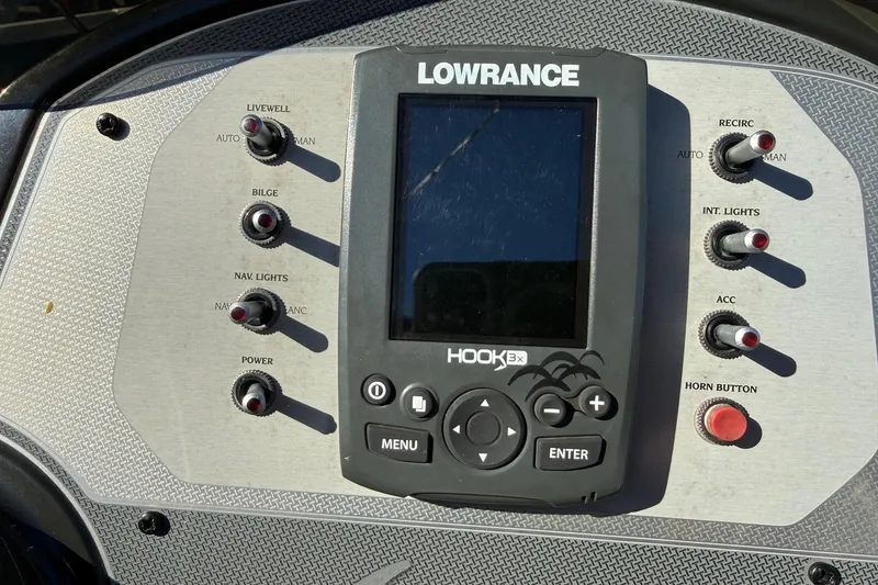 Slide: The Image of Control panel of a 2018 Lowe Stinger 175C boat with Lowrance Hook 3x display. - 11