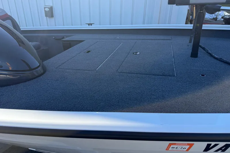 Slide: The Image of 2018 Lowe Stinger 175C boat deck with storage compartments and sleek design. - 15