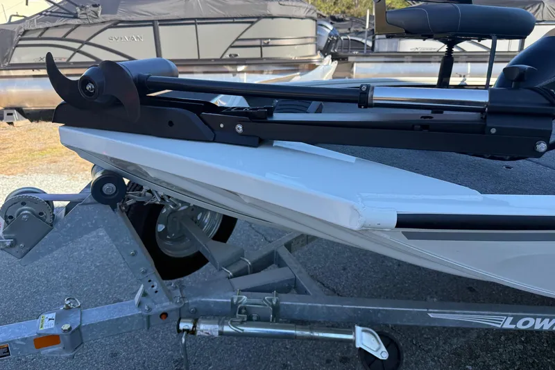 Slide: The Image of 2018 Lowe Stinger 175C boat on trailer with mounted trolling motor. - 18
