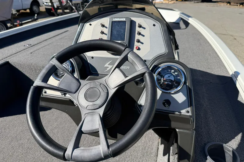 Slide: The Image of 2018 Lowe Stinger 175C boat dashboard with steering wheel and gauges. - 9