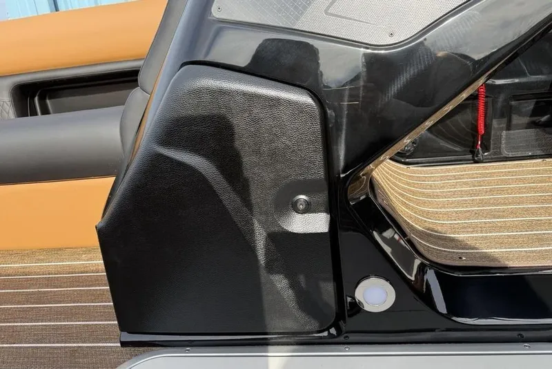 Slide: The Image of 2026 Premier 230 Sunsation interior detail with black and tan accents. - 12