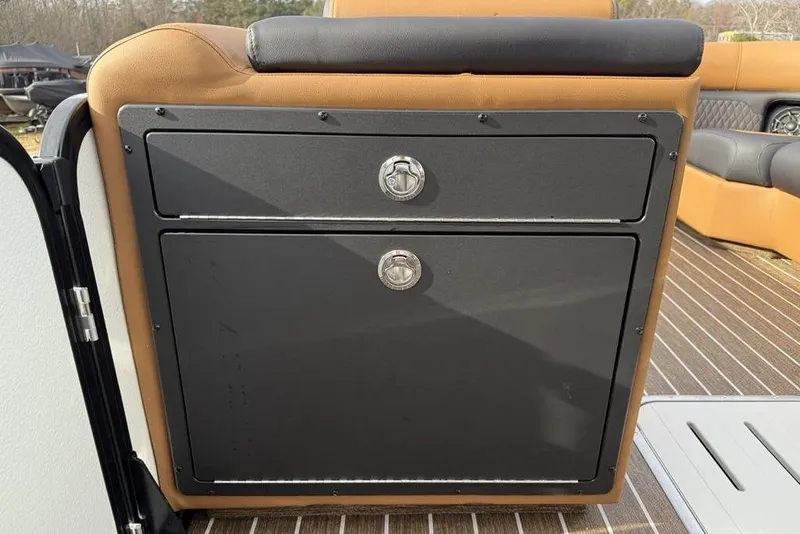 Slide: The Image of 2026 Premier 230 Sunsation boat interior with sleek storage compartments and cushioned seating. - 15