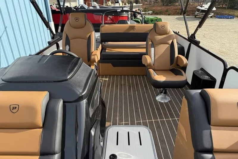 Slide: The Image of Interior of 2026 Premier 230 Sunsation boat with tan and black seating. - 19