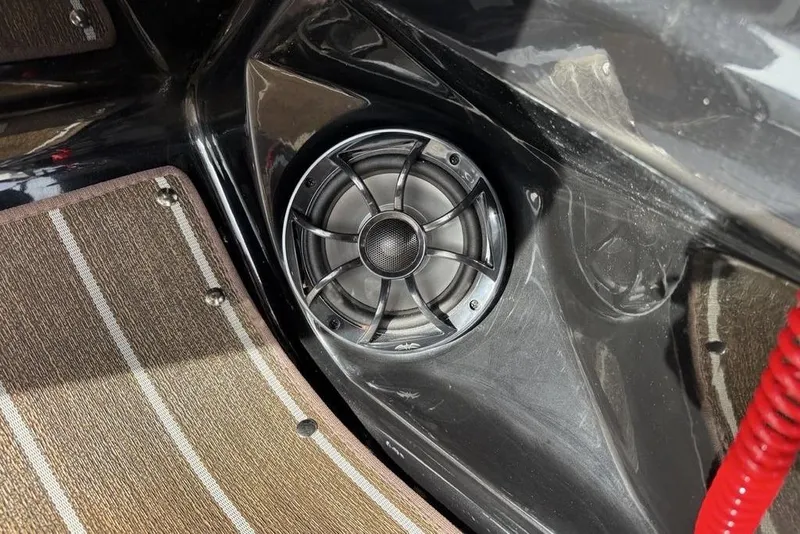 Slide: The Image of Speaker system in 2026 Premier 230 Sunsation boat interior with carpeted flooring. - 21