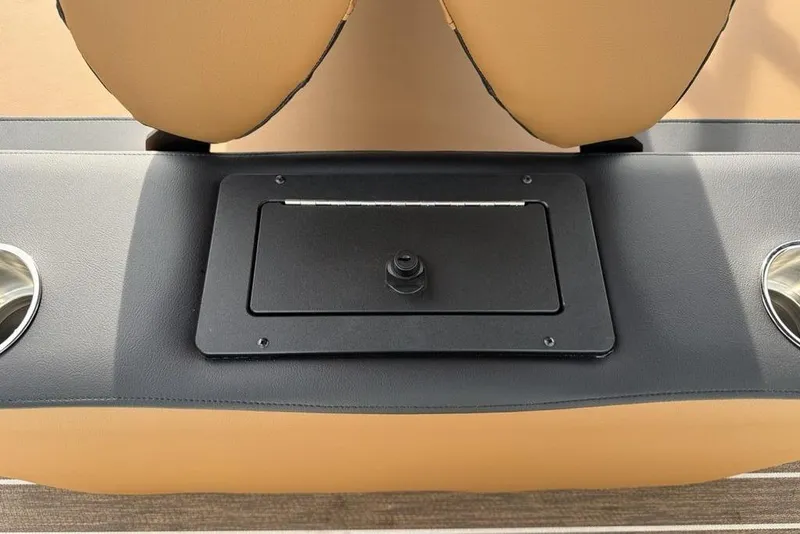 Slide: The Image of 2026 Premier 230 Sunsation boat seat with cup holders and storage compartment. - 26