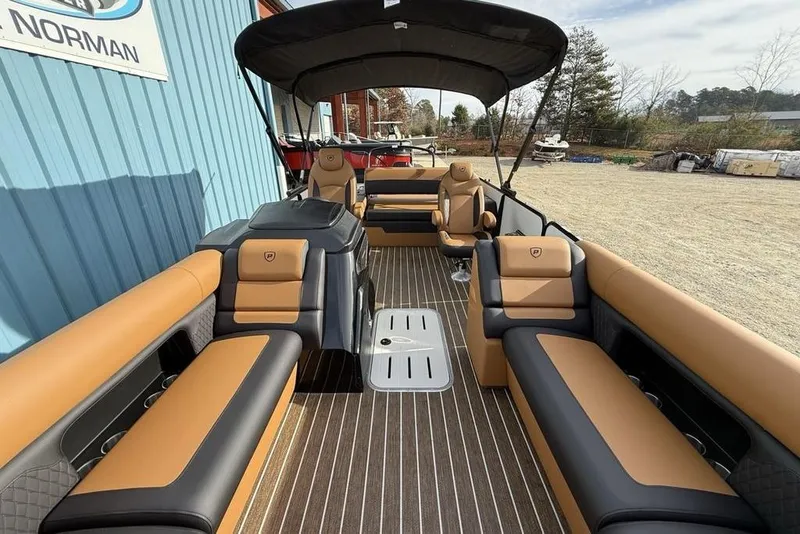 Slide: The Image of 2026 Premier 230 Sunsation pontoon boat with luxurious tan and black seating. - 28