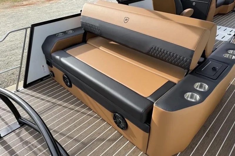 Slide: The Image of Luxurious seating on 2026 Premier 230 Sunsation boat with cup holders and speakers. - 29