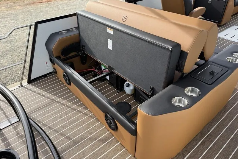 Slide: The Image of 2026 Premier 230 Sunsation boat interior with tan seating and cup holders. - 31