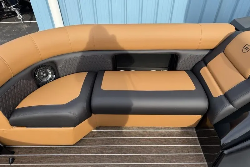 Slide: The Image of Luxurious seating on 2026 Premier 230 Sunsation boat with tan and black upholstery. - 7