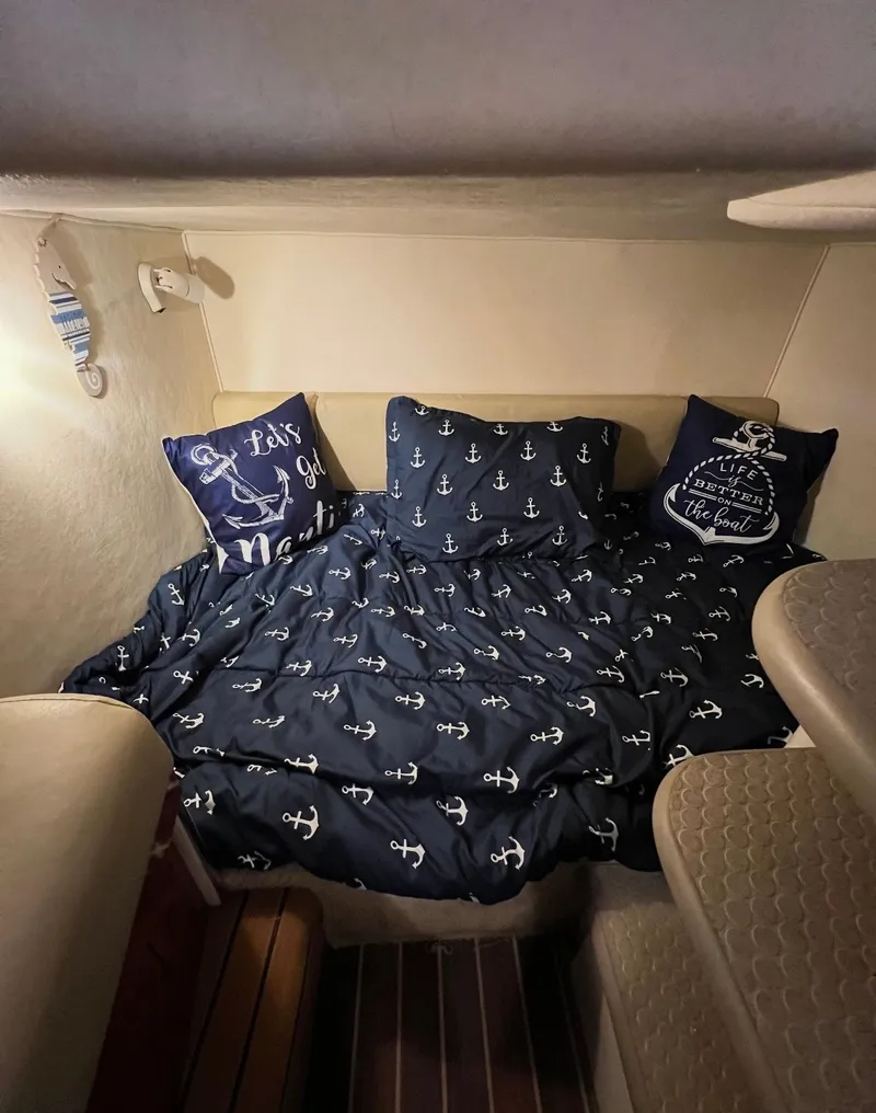 Slide: The Image of Interior of 2006 Sea Ray 290 Amberjack with nautical bedding decor. - 19