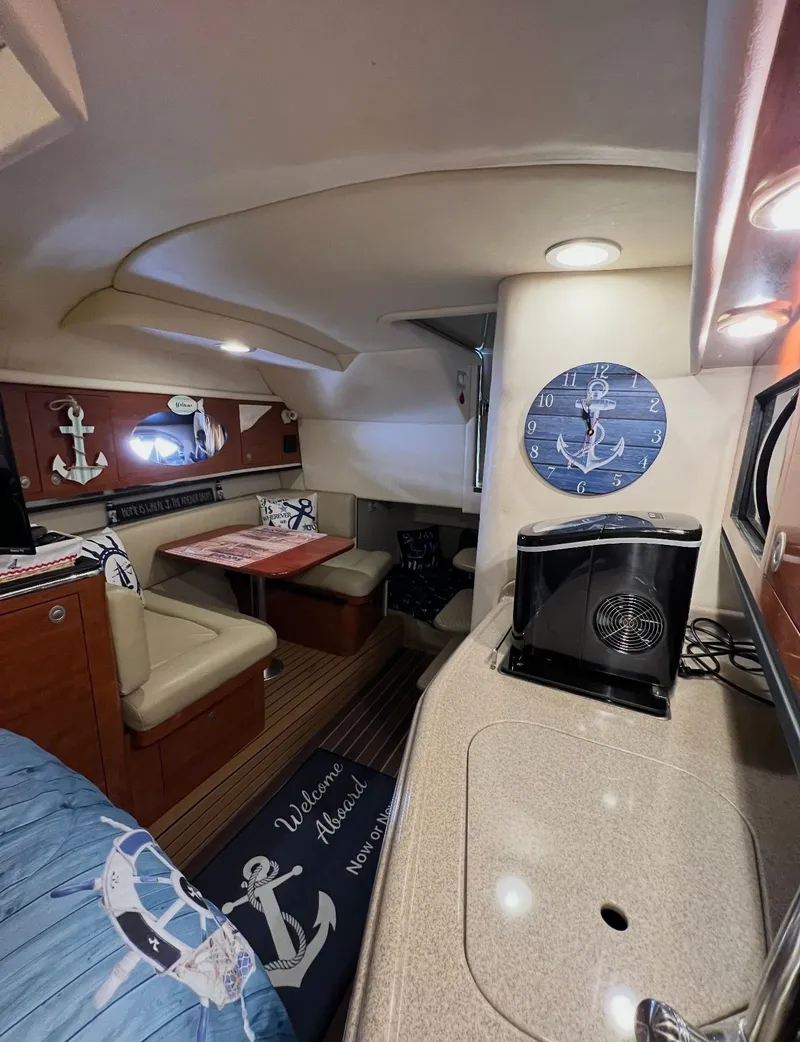 Slide: The Image of Interior of 2006 Sea Ray 290 Amberjack with nautical decor. - 20