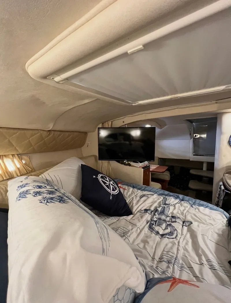 Slide: The Image of Interior of 2006 Sea Ray 290 Amberjack with bed and TV. - 21