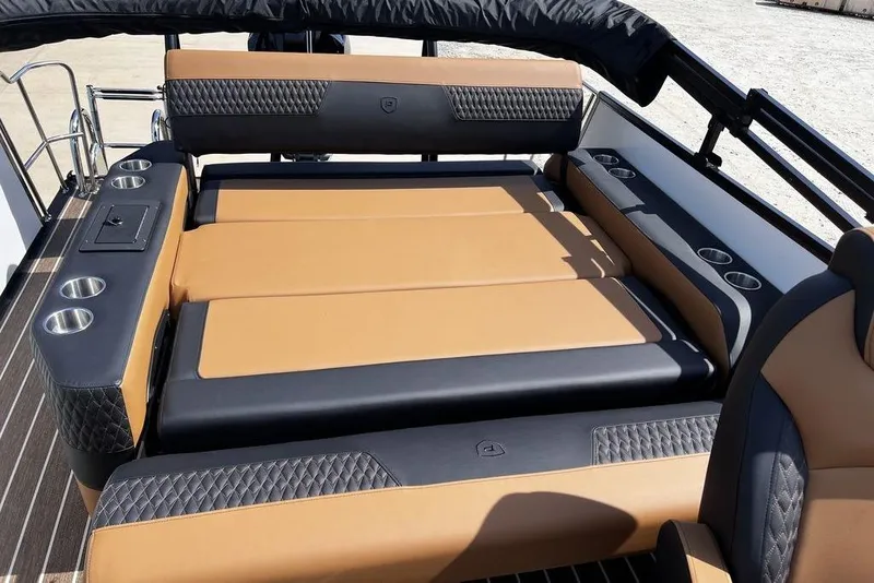 Slide: The Image of Luxurious seating on 2026 Premier 230 Solaris boat with cup holders and elegant design. - 11
