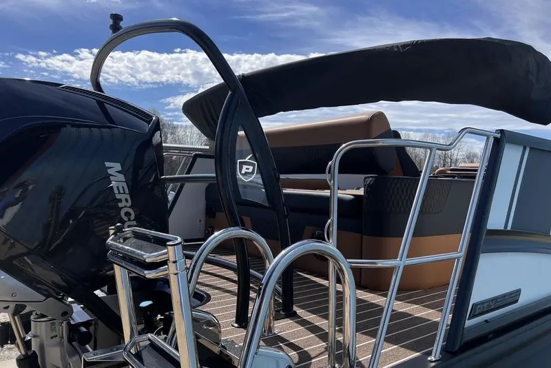 Slide: The Image of 2026 Premier 230 Solaris boat with Mercury engine and sleek seating design. - 12