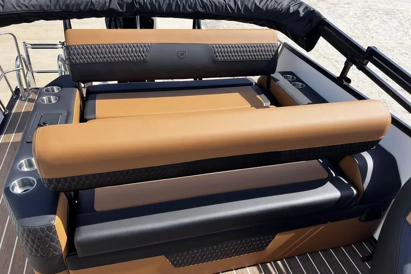 Slide: The Image of Luxurious seating on 2026 Premier 230 Solaris boat with cup holders and elegant design. - 15