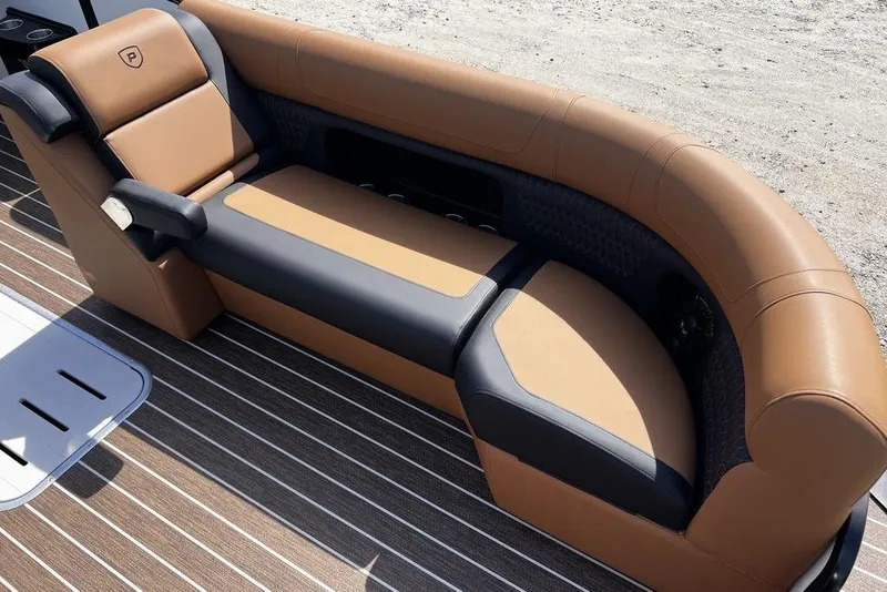 Slide: The Image of Luxurious seating on 2026 Premier 230 Solaris boat, featuring brown and black upholstery. - 19
