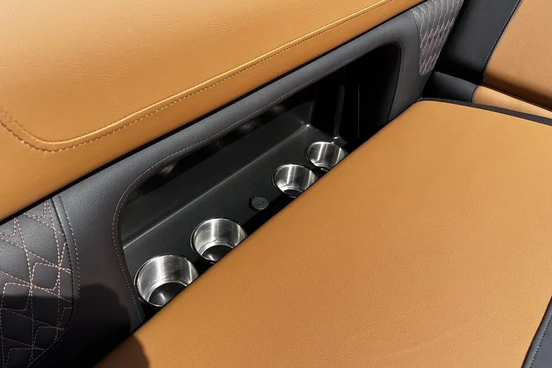 Slide: The Image of Luxurious tan leather seating with cup holders in 2026 Premier 230 Solaris. - 20
