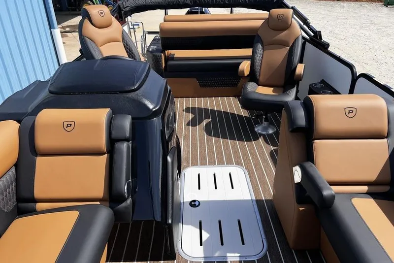 Slide: The Image of Luxurious interior of 2026 Premier 230 Solaris boat with tan and black seating. - 21
