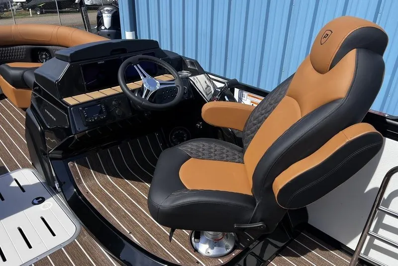 Slide: The Image of Luxurious helm of 2026 Premier 230 Solaris boat with plush seating and modern controls. - 22