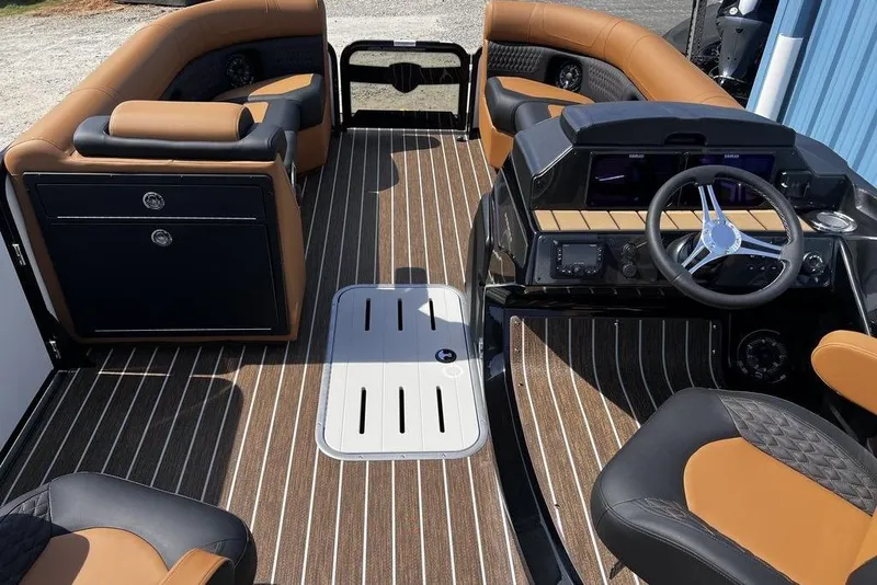 Slide: The Image of Interior of 2026 Premier 230 Solaris boat with luxurious seating and modern dashboard. - 23