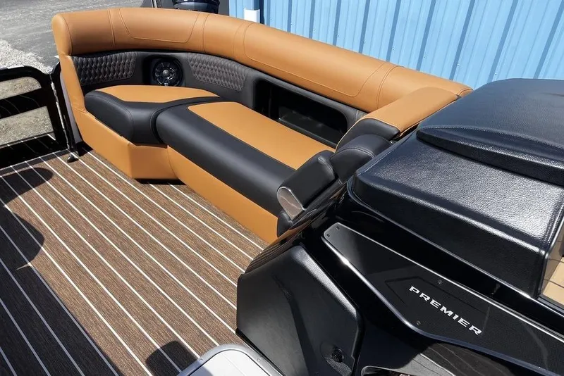 Slide: The Image of 2026 Premier 230 Solaris boat interior with luxurious tan and black seating. - 27