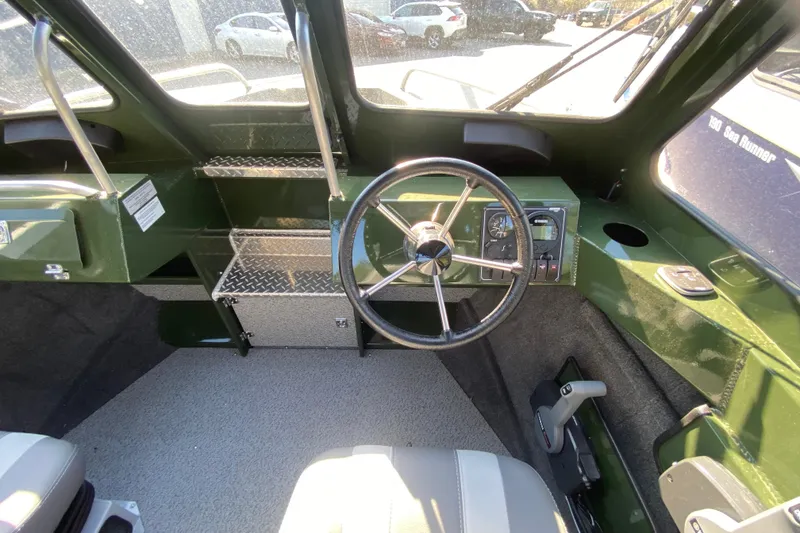Slide: The Image of Interior of 2026 Hewescraft 200 ProV ET HT boat with seating and steering wheel. - 5