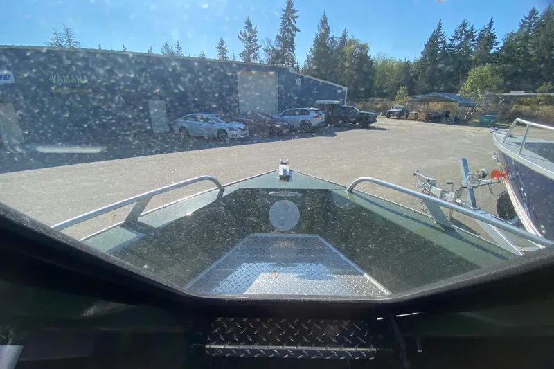 Slide: The Image of 2026 Hewescraft 200 ProV ET HT boat interior with steering wheel and dashboard controls. - 7