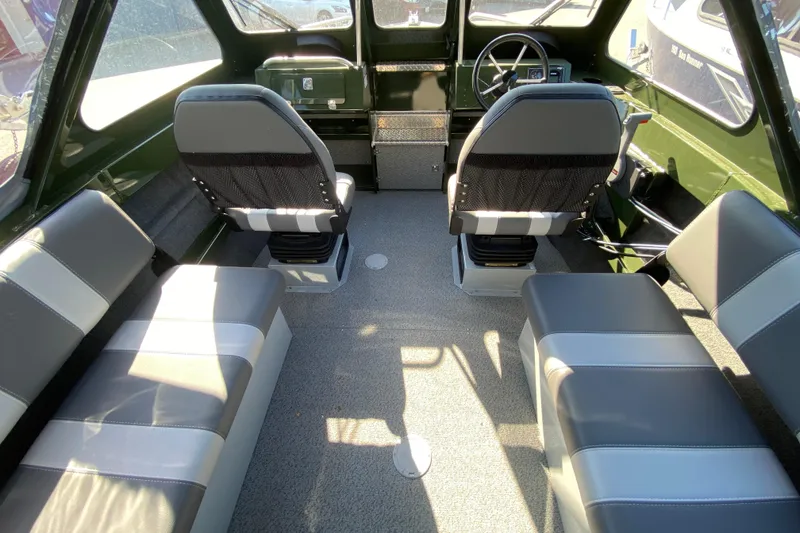 The Image of 2026 Hewescraft 200 ProV ET Hardtop boat on trailer, parked outdoors. - 0