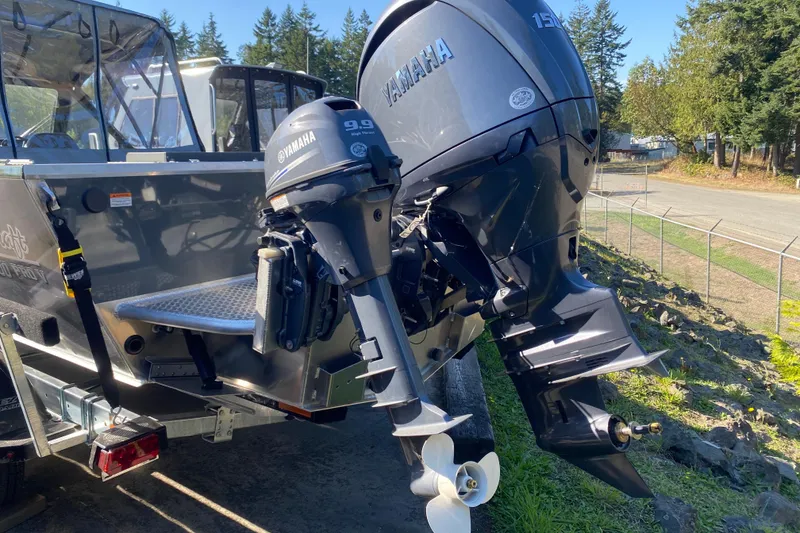 Slide: The Image of 2026 Hewescraft 200 ProV ET HT boat with Yamaha outboard motors, parked outdoors. - 11